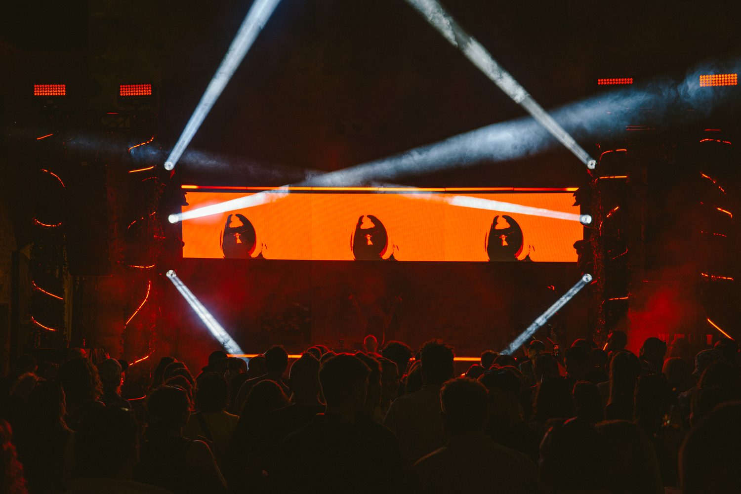 BON VOYAGE! at Schloss Fischhorn — orange stage, light beams, crowd