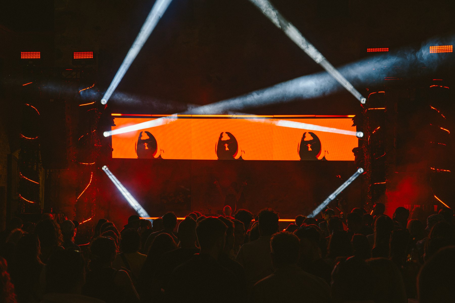 BON VOYAGE! — orange LED stage with the roundel, light beams and crowd